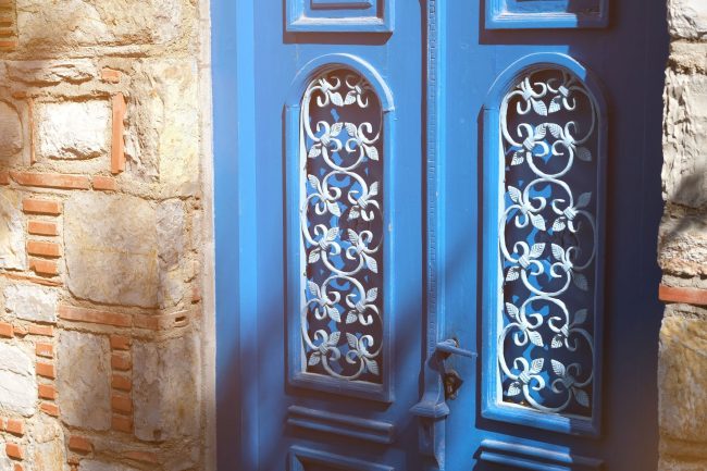 beautiful-house-door-on-old-stone-historical-building-in-sunlight